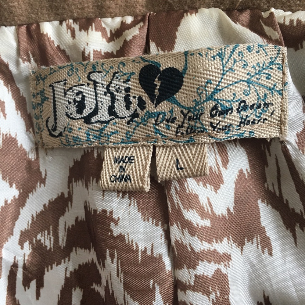 Camel colored woman’s coat